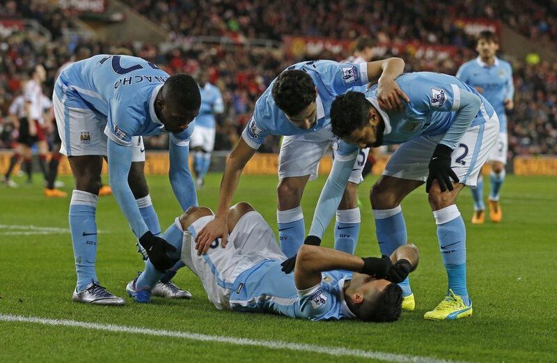 Manchester City’s Sergio Aguero lies down hurt after scoring, though he stayed in the match against Sunderland. Lee Smith / Action Images / Reuters