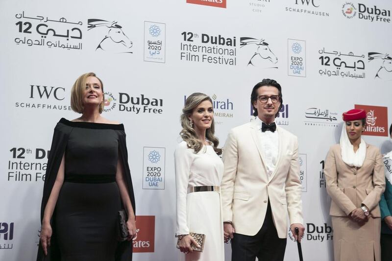 Hinde Boujemaa and Emirati Director Ali Mostafa and his wife attend the Opening Night Gala of ‘Room’ during day one of the 12th annual Dubai International Film Festival. Reem Mohammed / The National 