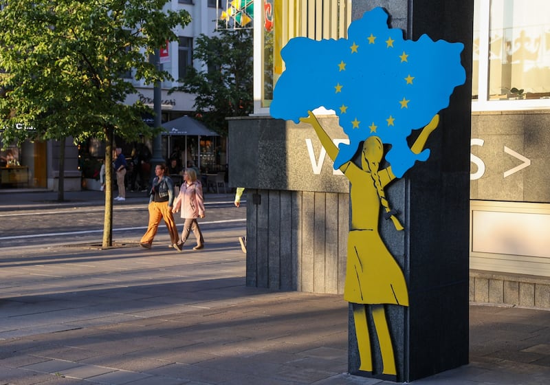 A mural of a girl holding a map of Ukraine aloft, in Vilnius. Bloomberg