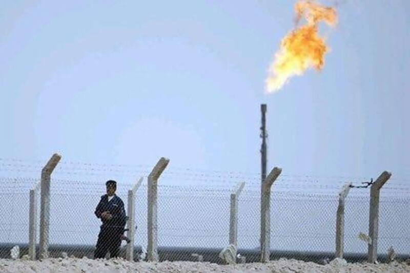 A policeman stands guard at the Rumaila oilfield in Basra.