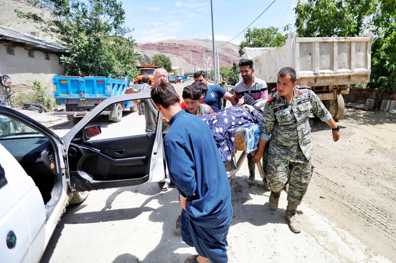 Rescue teams at work after flooding in Firuzkuh, Iran. EPA