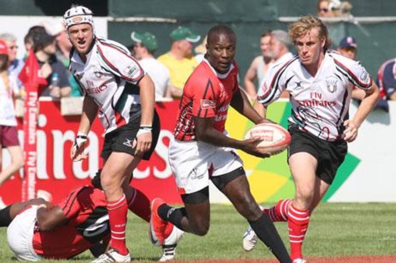 UAE, in white, were outplayed at the Dubai Rugby Sevens this year, and coach Wayne Marsters has called for a clearer selection policy.