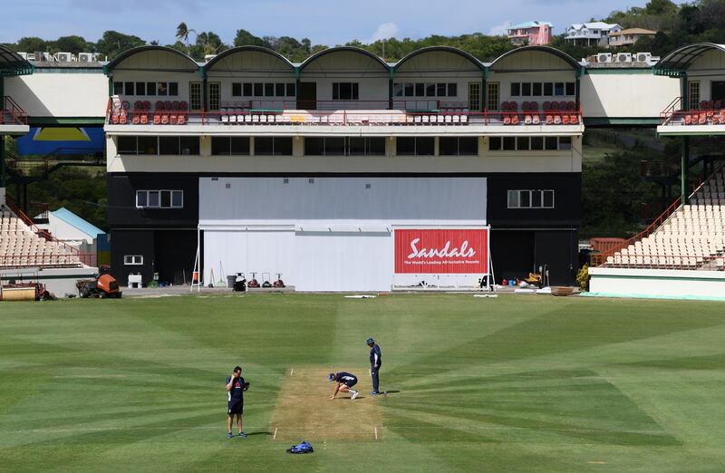 GROS ISLET, SAINT LUCIA - FEBRUARY 07:  England captain Joe Root and Head Coach Trevor Bayliss inspect the wicket during a Net Session at Darren Sammy National Cricket Stadium on February 07, 2019 in Gros Islet, Saint Lucia. (Photo by Shaun Botterill/Getty Images,)