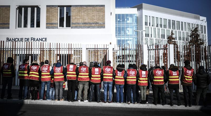 Unionists of the Banque de France demonstrate outside a bank notes sorting centre as part of a nationwide multi-sector strike against the French government's pensions overhaul. AFP