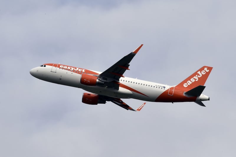 (FILES) This file photo taken on November 24, 2016 shows an Airbus A321 of English low-cost passenger carrier easyJet on November 24, 2016 at Toulouse-Blagnac airport.   
British airline easyJet said July 14, 2017, it had applied for a new air operator's certificate in Austria to allow it to continue flying in the European Union after Brexit regardless of the outcome of negotiations. / AFP PHOTO / PASCAL PAVANI