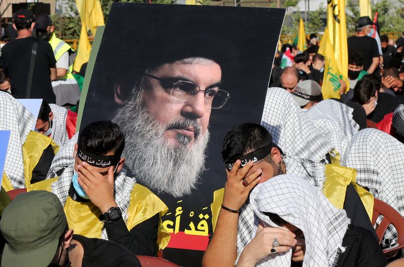 Hezbollah supporters mourn during Ashura Day procession in southern suburb of Beirut. EPA