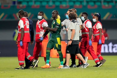 Soccer Football - Africa Cup of Nations - Round of 16 - Senegal v Cape Verde - Kouekong Stadium, Bafoussam, Cameroon - January 25, 2022 Senegal's Sadio Mane receives medical attention after sustaining an injury REUTERS / Thaier Al-Sudani
