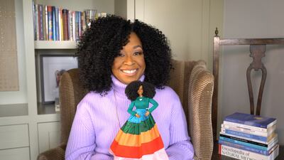 Television producer Shonda Rhimes and the Barbie doll made for her. Photo: Mattel 