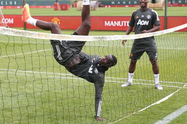 Manchester United's Eric Bailly with a spectacular overhead kick during a game of football tennis. Getty