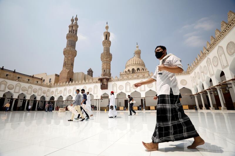 Muslims wearing protective face masks are seen at Al-Azhar mosque for the first Friday prayers after reopening it as the government eased restrictions, in the old Islamic area of Cairo, Egypt. Reuters