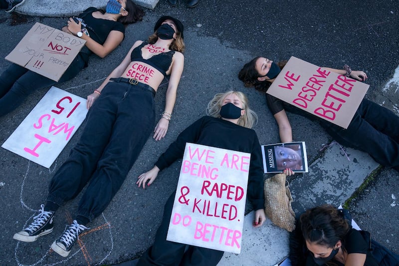 NO 131 SOUTH AFRICA: Women protest against gender violence outside parliament in Cape Town on June 30, 2020. Crimes such as carjacking, ATM robbery, home invasion and rape remain very high, making the country among the most dangerous in the world. Nic Bothma / EPA
