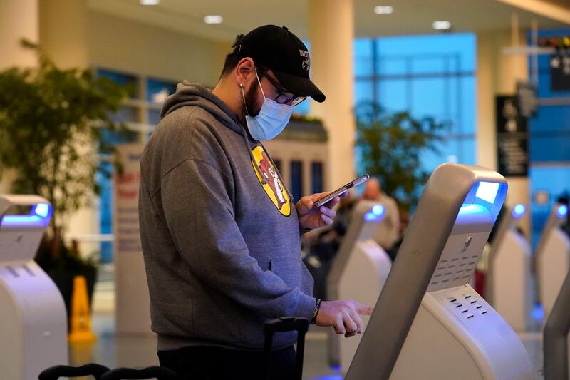 A passenger checks in at Chicago's Midway Airport. AP