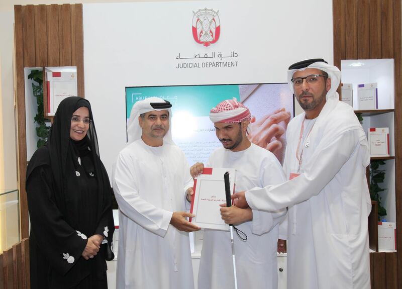 Abu Dhabi Judicial Department launched the UAE's first ever constitution written in Braille format on Thursday. Courtesy Wam