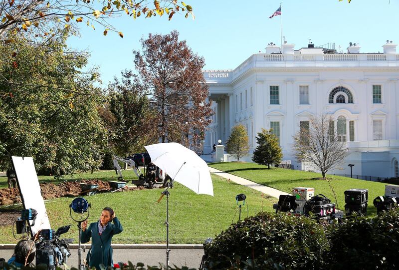 Journalists wait for news after early results in the 2020 US Presidential election at the White House in Washington. Reuters