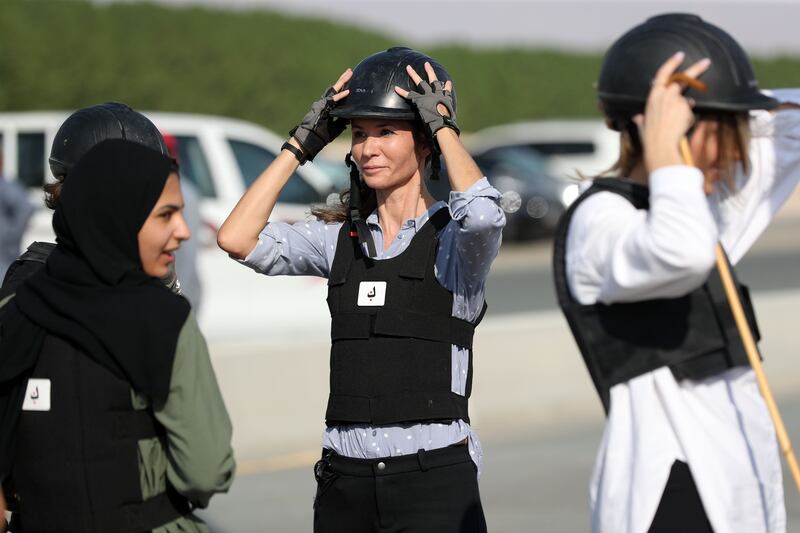 Female jockeys preparing for the camel race 