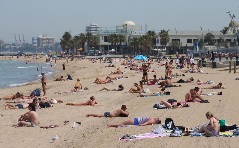 People flock to St Kilda beach as a heatwave sweeps across the state of Victoria, in St Kilda, south of Melbourne.  EPA