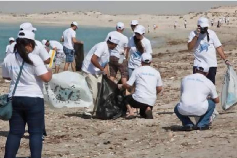 More than 300 volunteers took part in yesterday's Clean the Beach session at a protected marine reserve in Jebel Ali. Antonie Robertson / The National