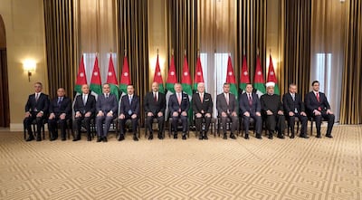 A handout picture released by the Jordanian Royal Palace on November 7, 2019 shows Jordanian King Abdullah II (C) and his Prime Minister Omar Razzaz (6th-L) posing for a group photo with new sworn-in ministers following a cabinet reshuffle in the capital Amman.  - RESTRICTED TO EDITORIAL USE - MANDATORY CREDIT "AFP PHOTO / JORDANIAN ROYAL PALACE / YOUSEF ALLAN" - NO MARKETING NO ADVERTISING CAMPAIGNS - DISTRIBUTED AS A SERVICE TO CLIENTS
 / AFP / Jordanian Royal Palace / - / RESTRICTED TO EDITORIAL USE - MANDATORY CREDIT "AFP PHOTO / JORDANIAN ROYAL PALACE / YOUSEF ALLAN" - NO MARKETING NO ADVERTISING CAMPAIGNS - DISTRIBUTED AS A SERVICE TO CLIENTS
