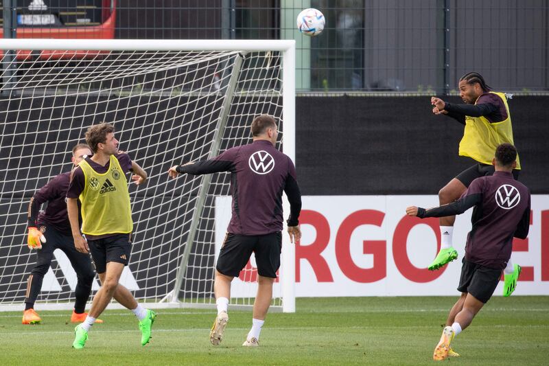 Germany forward Serge Gnabry, far right, kicks the ball during a training session. AFP