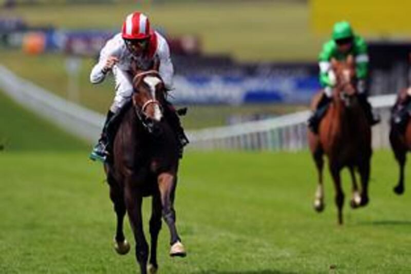 Ridden by Neil Callan, Misheer strides to victory in the Cherry Hinton Stakes at Newmarket yesterday.