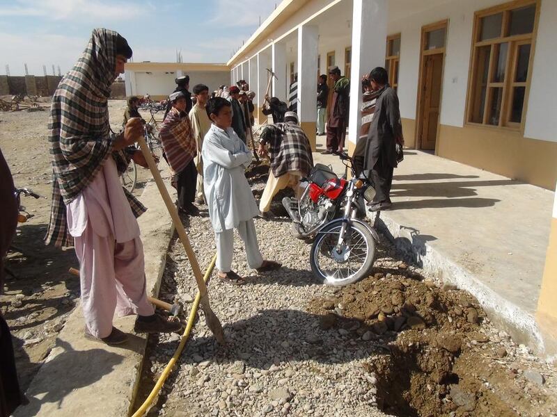 Community members build the school in Shin Kalay, a village in Afghanistan's Helmand province. Photo courtesy the Afghan Appeal Fund.