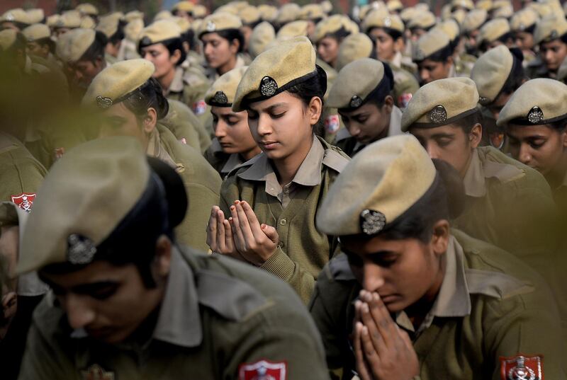 Indian policewomen constables meditate during a yoga session in Jalandhar, Punjab. Shammi Mehra / AFP Photo