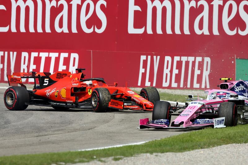 MONZA, ITALY - SEPTEMBER 08: Lance Stroll of Canada driving the (18) Racing Point RP19 Mercedes spins with Sebastian Vettel of Germany driving the (5) Scuderia Ferrari SF90 behind during the F1 Grand Prix of Italy at Autodromo di Monza on September 08, 2019 in Monza, Italy. (Photo by Charles Coates/Getty Images)