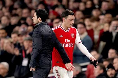 Arsenal's Mesut Ozil and manager Mikel Arteta. PA