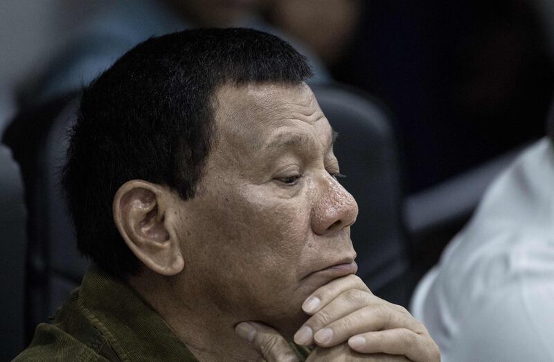 Philippine President Rodrigo Duterte monitors the path of Typhoon Mangkhut at the National Disaster Risk Reduction and Management Council (NDRRMC) Operations Center at Camp Aguinaldo in Manila on September 13, 2018. - A super typhoon roared toward the Philippines on September 13, prompting thousands to evacuate ahead of its heavy rains and fierce winds that are set to strike at the weekend before moving on to China. (Photo by NOEL CELIS / AFP)