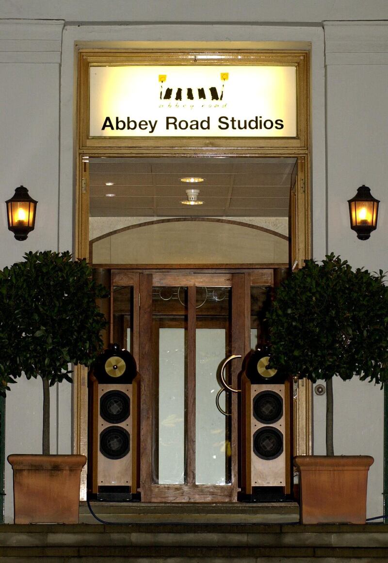 This picture shows the Abbey road studios in London where fans came to leave flowers and pictures in memory of British musician George Harrison who died from cancer 30 November 2001. The Abbey studios decided to put speakers at the entrance of the studio and play George Harrison music.
AFP PHOTO/Nicolas ASFOURI.