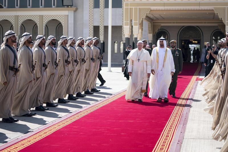 ABU DHABI, UNITED ARAB EMIRATES - February 05, 2019: Day three of the UAE Papal visit - HH Sheikh Mohamed bin Zayed Al Nahyan, Crown Prince of Abu Dhabi and Deputy Supreme Commander of the UAE Armed Forces (R), bids farewell to His Holiness Pope Francis, Head of the Catholic Church (L), at the Presidential Airport. 


( Mohamed Al Hammadi / Ministry of Presidential Affairs )
---