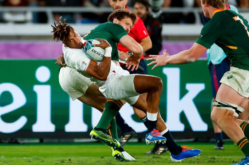 England wing Anthony Watson  is tackled by South Africa centre Frans Steyn. AFP