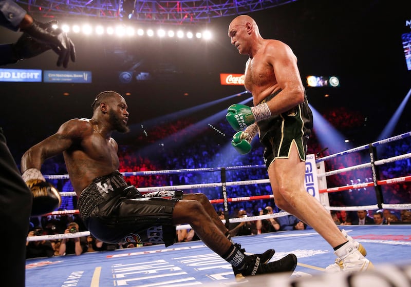 Tyson Fury knocks down Deontay Wilder during their rematch in Las Vegas in February 2020.