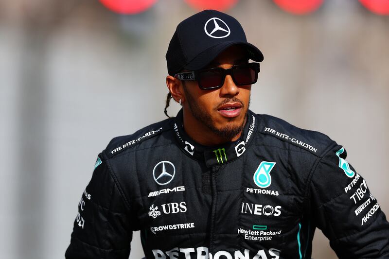 ABU DHABI, UNITED ARAB EMIRATES - NOVEMBER 20: Lewis Hamilton of Great Britain and Mercedes looks on ahead of the F1 2022 End of Year photo prior to the F1 Grand Prix of Abu Dhabi at Yas Marina Circuit on November 20, 2022 in Abu Dhabi, United Arab Emirates. (Photo by Mark Thompson / Getty Images)