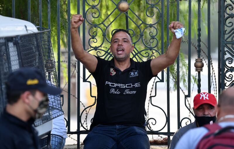 Seifeddine Makhlouf, Tunisian parliament member and spokesperson of the Al Karama coalition, gestures outside the Parliament which was cordoned-off by the military in the capital Tunis, following a move by the president to suspend the country's parliament and dismiss the Prime Minister.  AFP