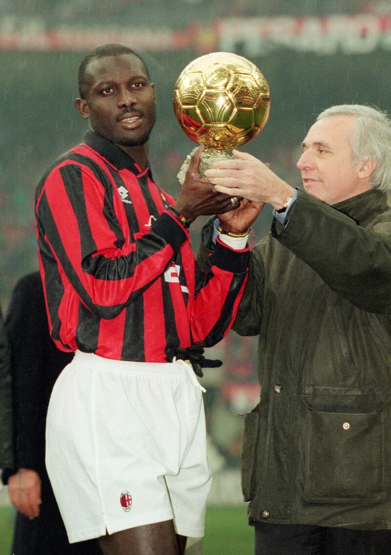 George Weah of AC Milan is presented the European Footballer of the Year award in 1996