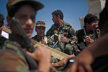 Houthi rebels ride on a vehicle during a funeral procession of Houthi fighters who were killed in recent fighting with forces of Yemen's Saudi-backed internationally recognized government, in Sanaa, Yemen on February 16, 2021. AP