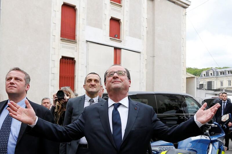 French president Francois Hollande waves as he leaves a restaurant in Tulle — a town in his electoral district of Correze — on May 7, 2017, during the second round of the presidential election. Regis Duvignau / Reuters
