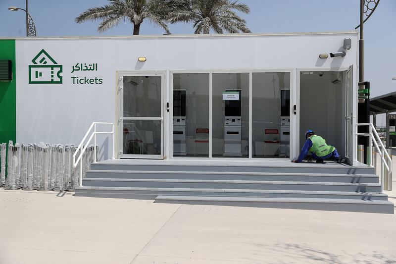 A worker finishes work on a ticket booth at Expo 2020 Dubai. Pawan Singh / The National