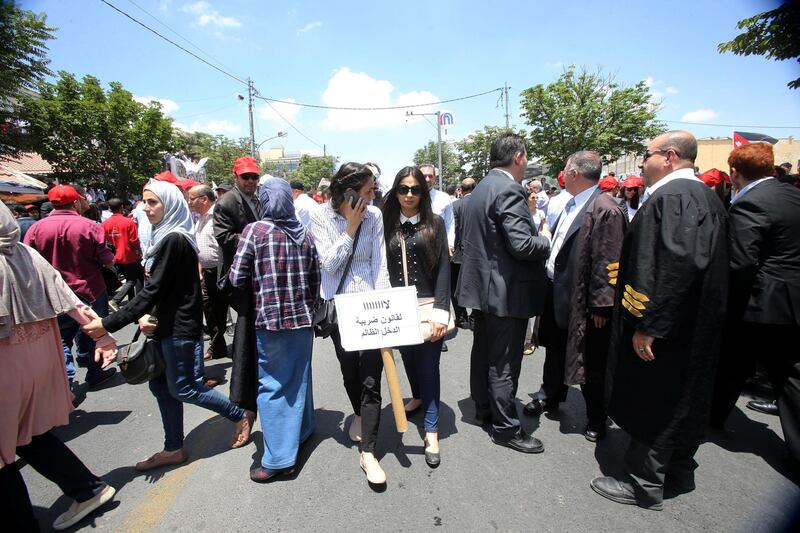 Jordanians gather at the professional Associations compound to participate at the country's strike refusing the new incom law draft put by the government and sent to the parliament, in Amman, Jordan, on May 30, 2018. (Salah Malkawi for The National)