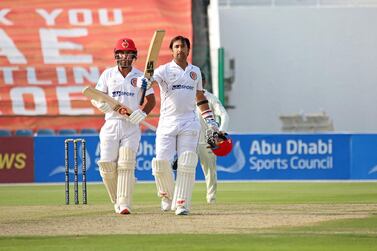 Afghanistan captain Asghar Afghan celebrates after reaching his century against Zimbabwe. 