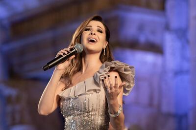 epa07730336 Lebanese singer Nancy Ajram performs during the 2019 Jerash Festival of Culture and Arts at the Jerash archeological site, Jerash, some 46 km North of Amman, Jordan, 20 July 2019. The Jerash festival takes part from 18 to 27 July 2019.  EPA/ANDRE PAIN