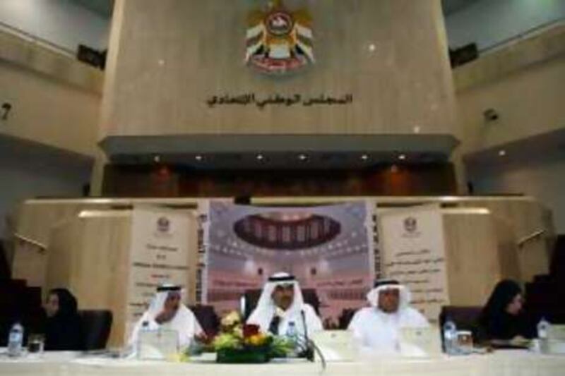 Abu Dhabi, UAE - July 8, 2008 Abdul Aziz al Ghurair, speaker of the Federal National Council, middle; Mohammed al Mazrouei, Secretary General of the FNC, left;  and Obaid al Muhairi, an FNC member from Sharjah, right take questions during a press conference at the Parliament building. (Nicole Hill / The National) *** Local Caption ***  NH FNC03.jpg