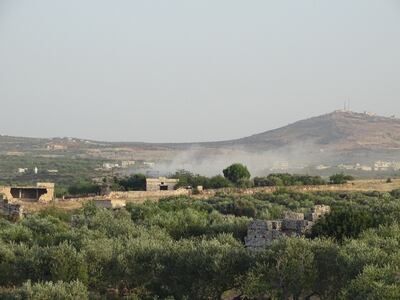 Smoke rises after air strikes in the Zawiya Mountain area of Idlib province in north-west Syria.