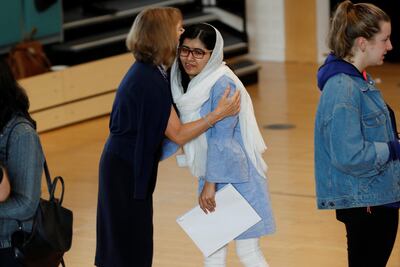 Malala Yousefzai is congratulated after collecting her 'A' level exam results at Edgbaston High School for Girls in Birmingham, Britain August 17, 2017. REUTERS/Darren Staples