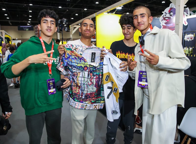 Friends Falah, Sultan, Hamdan and Zayed around the shopping stalls