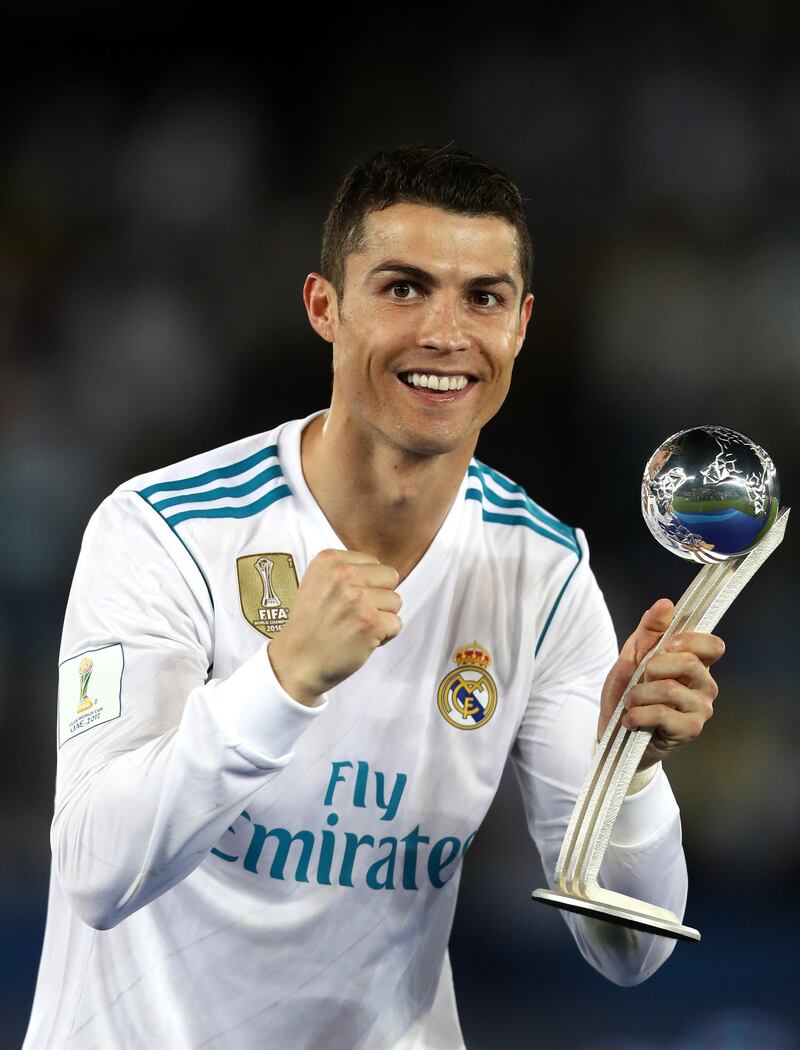 ABU DHABI, UNITED ARAB EMIRATES - DECEMBER 16:  Cristiano Ronaldo of Real Madrid celebrates with his adidas Golden Ball trophy after the FIFA Club World Cup UAE 2017 Final between Gremio and Real Madrid at the Zayed Sports City Stadium on December 16, 2017 in Abu Dhabi, United Arab Emirates.  (Photo by Francois Nel/Getty Images)