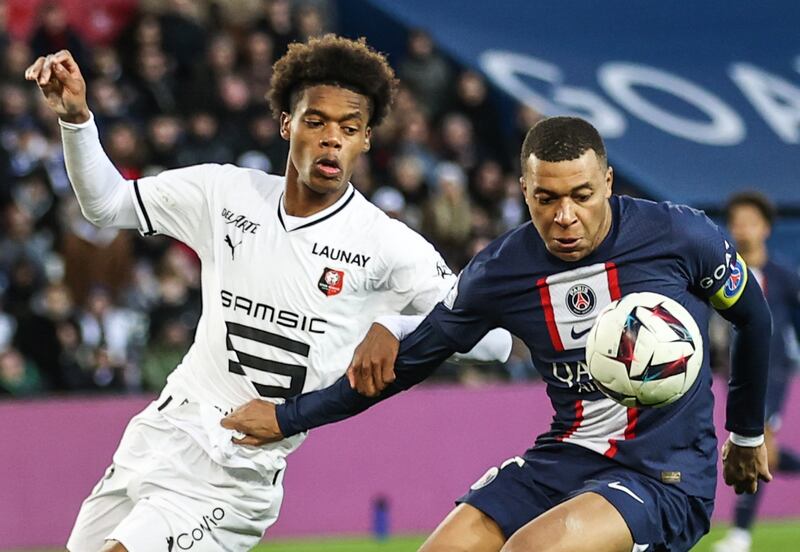 Paris Saint-Germain's Kylian Mbappe and Warmed Omari of Rennes in action. EPA