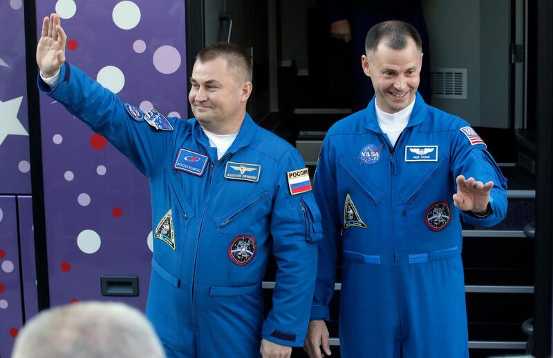US astronaut Nick Hague, right, and Russian cosmonaut Alexey Ovchinin, wave to their relatives prior to launch. AP Photo