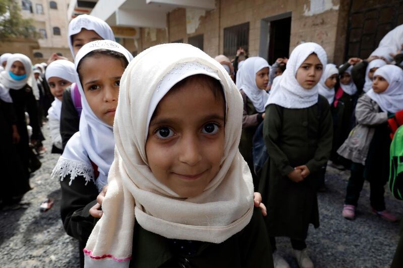 Yemeni schoolgirls line up to do light exercises before attending classes at a primary school in Sana'a, Yemen. EPA